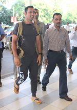 Mahendra Singh Dhoni snapped at airport on 12th Dec 2015